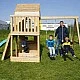 Μεγάλο Ξύλινο Παιδικό Σπιτάκι για την Αυλή GINGER HOME με Τσουλήθρα, 2 Κούνιες, Πλαίσιο Αναρρίχησης και Σκάμμα – 250×150×267 εκ.