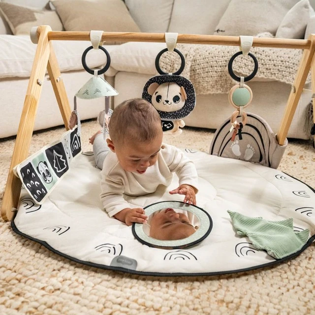 Active gymnastics Tiny Love Luxe Gymini από τη σειρά Black&White Décor, με στρογγυλό πατάκι διαμέτρου 92 cm, ξύλινη καμάρα και επιλογή 6 παιχνιδιών, 0m+