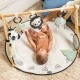 Active gymnastics Tiny Love Luxe Gymini από τη σειρά Black&White Décor, με στρογγυλό πατάκι διαμέτρου 92 cm, ξύλινη καμάρα και επιλογή 6 παιχνιδιών, 0m+